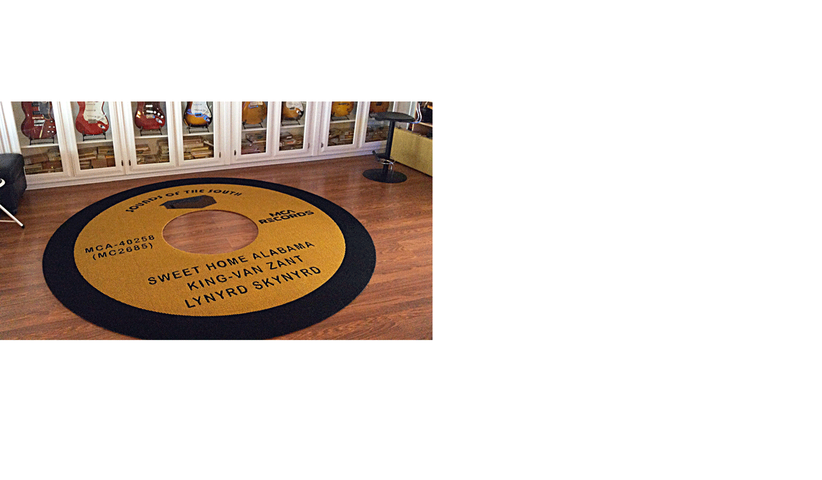 Custom circle black and yellow area rug in the shape or an vinyl record in music room